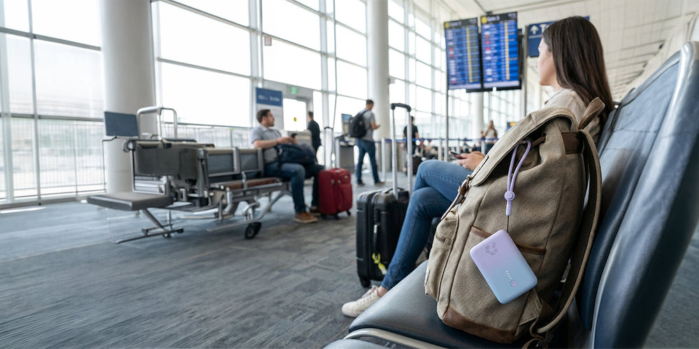 Can you bring a portable charger on a plane? A portable charger on a backpack at an airport gate.