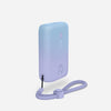 A compact portable charger in a gradient of blue to purple with a lanyard loop, displaying the brand logo.