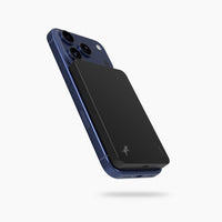 Blue iphone with a black nimble magnetic phone charger on the back, magsafe phone charger magnetic battery pack.