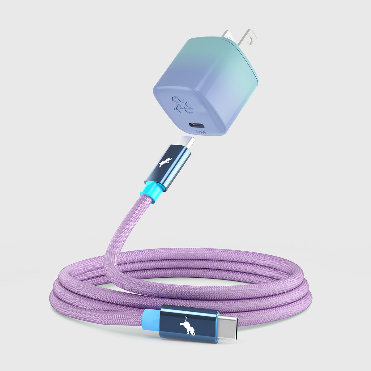 A USB-C charging cable with a lavender purple braided body, featuring a blue and purple gradient wall charger and matching blue connector housings with a white dog logo, shown on a white background.
