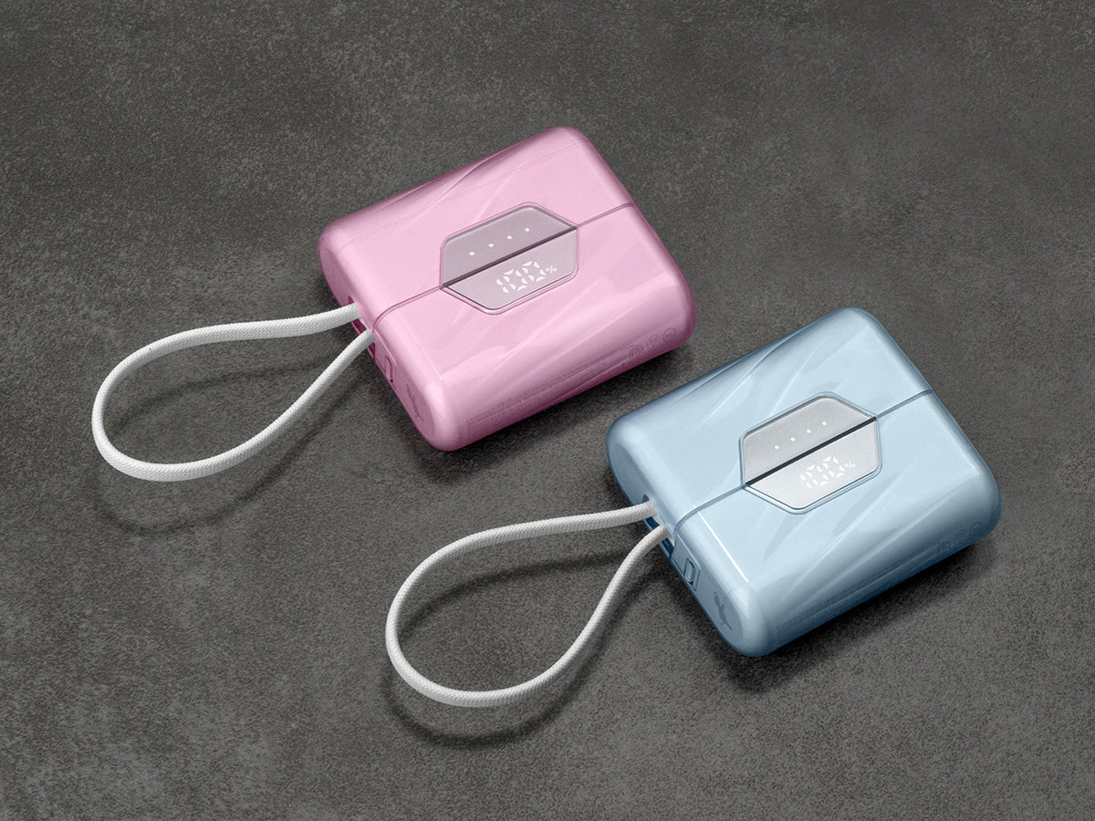Two Limited Edition, Apple Exclusive, SharePower portable chargers with built-in USB-C cables on a dark gray background
