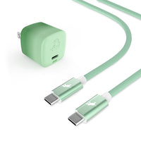 A mint green USB-C charging adapter and matching braided USB-C cable in the color Coastal Moss/Emerald Cove with metallic connector housings, shown on a clean white background.