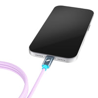 A close-up of a smartphone with a black screen, connected to a light purple 
Ocean Amethyst braided charging cable with a metallic connector, on a white background.